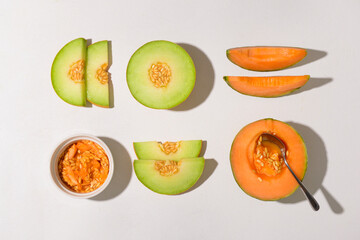 Ripe cut melons on white background