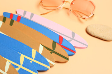 Different mini surfboards on yellow background