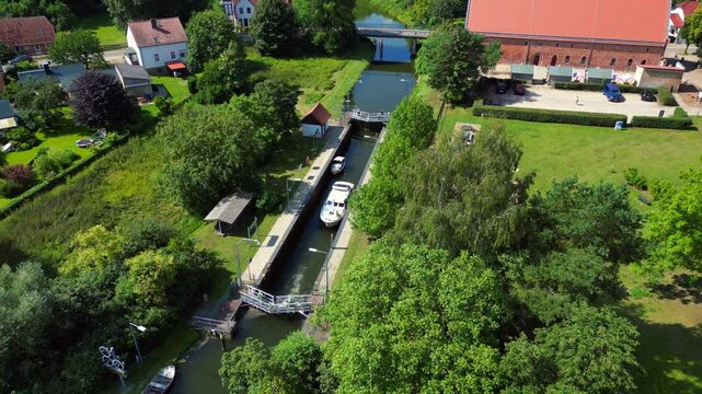 boats in sluice canal lock on summer day. Nice aerial view flight drone