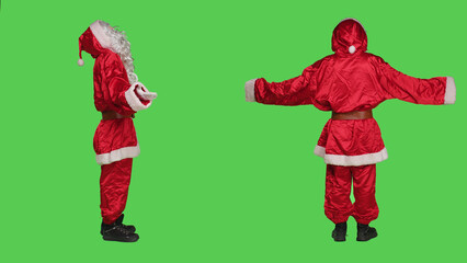Santa claus confused on greenscreen, doing i dont know sign and feeling clueless in studio. Father christmas in suit acting uncertain and unsure about answer, doubtful character shrugging.