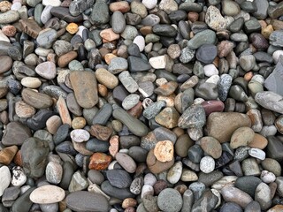 natural background of sea pebbles. emply beach. 