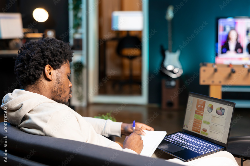 Poster man working from home doing math calculations using statistical data financial graphs on laptop. rem