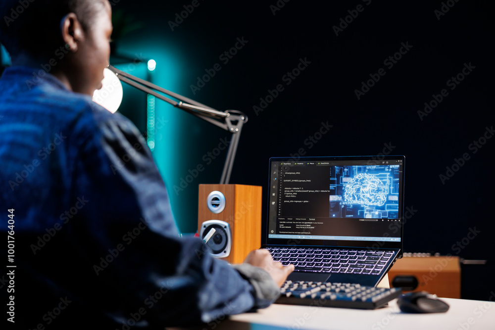Poster professional female developer manages neural network at desk, working with code on laptop. over the 