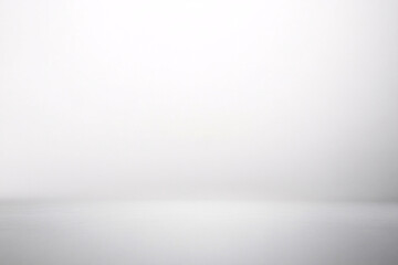 Obraz premium A smooth, minimalistic white background with soft gradients and gentle lighting, creating a clean empty space 
