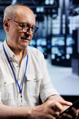 Trained serviceman in data center providing dedicated VPN servers able to deliver encrypted...