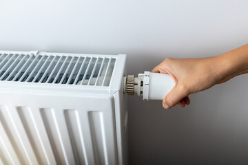modern radiator for heating in the apartment with power regulators. ideal for those costs of heating and utilities in winter, person a person regulates the level of heat