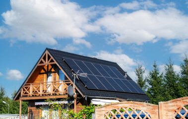 Obraz premium photovoltaic panels on the roof of the house