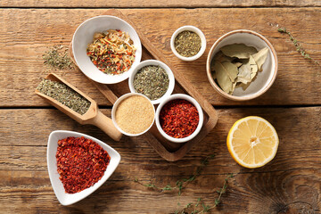 Composition with aromatic spices on wooden table