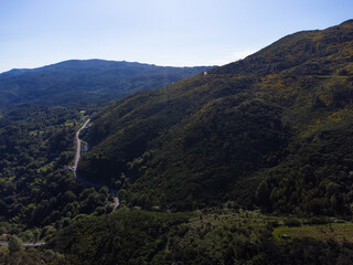 Obraz premium Beautiful and scenic aerial view of village of Gerês, Soajo, Portugal. Spring day. City, houses, mountains and waterfalls. Near Porto. Drone.