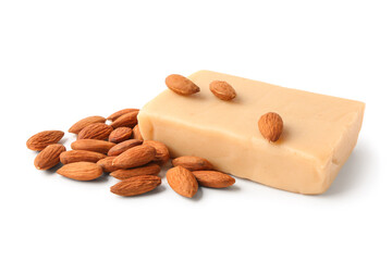 Bar of tasty marzipan bar and almond nuts on white background