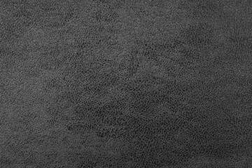 Cloth structure of jacquard black fabric with abstract shabby texture background closeup, macro