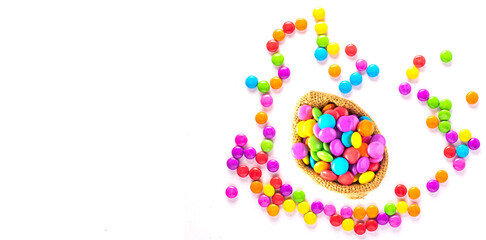 Gourmet chocolate candy assortment laid out on slate background