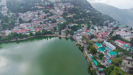 Fototapeta premium Aerial view of nainital lake in nainital city. Beautiful landscape of himalayan hill station nainital, uttarakhand in India
