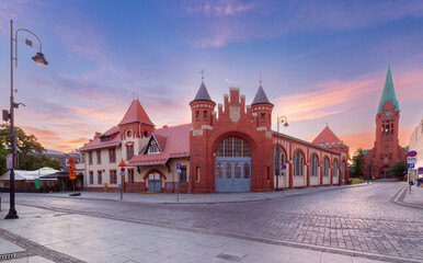 View of the historic Old Fire Station and St. Andrew Bobola Church at sunrise in Bydgoszcz, Poland,...