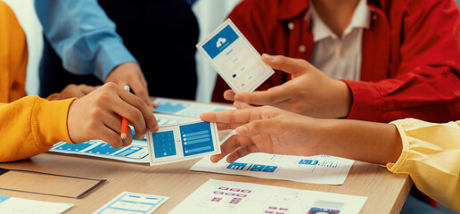 Panorama banner of startup company employee planning on user interface prototype for mobile application or website in office. UX UI designer brainstorm user friendly interface plan. Synergic