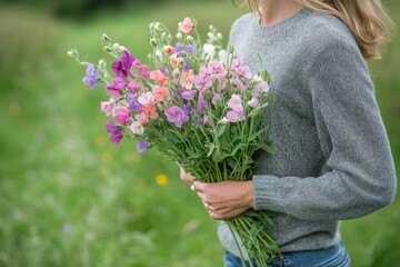 Gardener with gray hair cutting flowers in the backyard