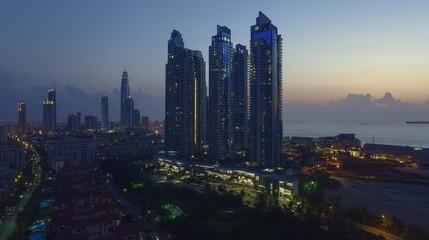 Fototapeta premium Stunning Cityscape of Skyscrapers and Illuminated Buildings at Sunset