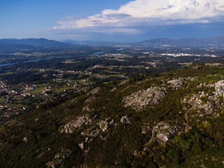 Obraz premium Aerial view of Vila Nova de Cerveira, Portugal. Miradouro do Cervo Viewpoint. Alto Minho, Viana do Castelo in Portugal. On one side of the river is Portugal, on the other is Spain