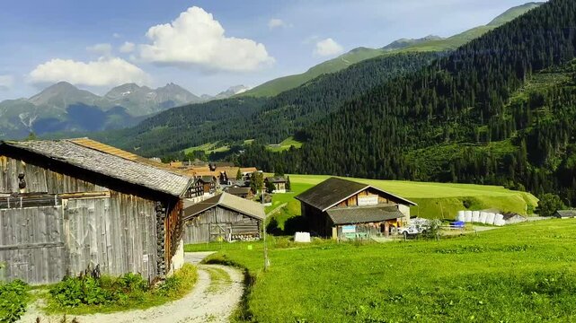 Panoramic View From Glacier Express Train over City of Sedrun and Mountainscape and Valley in a Sunny Summer Day in Sedrun, Surselva, Oberalp, Grisons, Switzerland, Europe