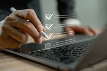 Business performance checklist, businessman using laptop doing online checklist survey, filling out digital form checklist, take an assessment, questionnaire, evaluation, online survey, online exam.