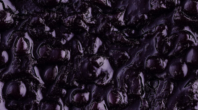 a close-up, top-down view, texture background of black currant jam spread across the entire frame, filling the image with its deep purple color and smooth texture