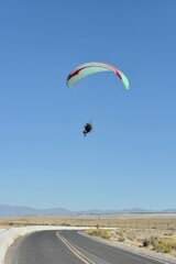 paragliding in the blue sky