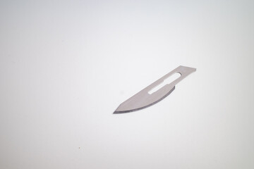 closeup photo of new surgical blade