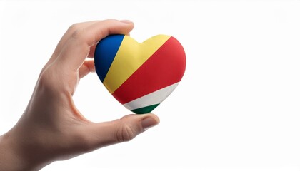 手で持っているセーシェルの国旗のハート(Heart of Seychelles flag held in hand.)
