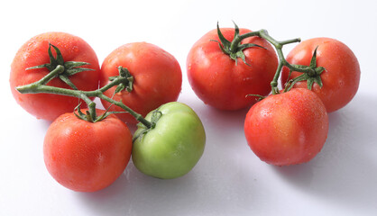 red tomatoes on a white background