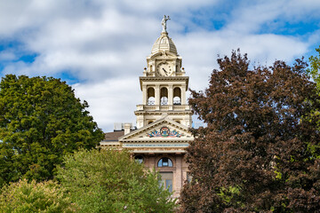 Top of Ionia County, MI Courthouse with Blue Sky and Green Trees