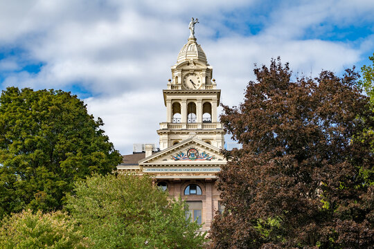 Top of Ionia County, MI Courthouse with Blue Sky and Green Trees