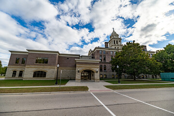 Wide Angle of Ionia County, MI Courthouse with Blue Sky and Green Grass