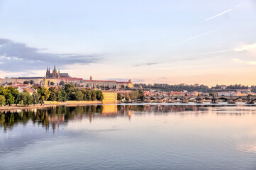 Fototapeta premium Prague, Czech Republic - July 19, 2024: Early morning views of the Vltava River and the Charles Bridge in Prague in the Czech Republic 