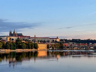 Prague, Czech Republic - July 19, 2024: Early morning views of the Vltava River and the Charles Bridge in Prague in the Czech Republic
