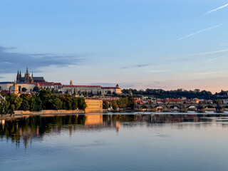 Obraz premium Prague, Czech Republic - July 19, 2024: Early morning views of the Vltava River and the Charles Bridge in Prague in the Czech Republic 