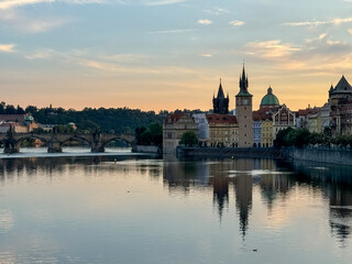 Prague, Czech Republic - July 19, 2024: Early morning views of the Vltava River and the Charles Bridge in Prague in the Czech Republic
