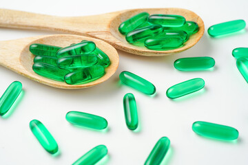 Softgels green, supplements, fish oil, omega 3, vitamin D3, vitamin E oil filled capsules
