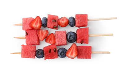 Skewers with tasty watermelon, blueberries and strawberries isolated on white, top view