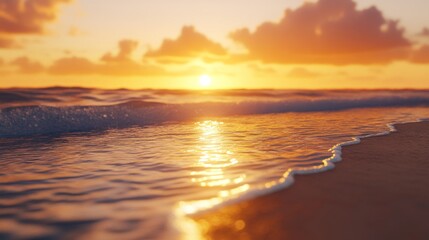 Sunset on a pristine beach, golden light spreading across the water and sand