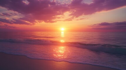 Obraz premium Sunset paints the sky in orange and purple over a serene beach, clear water reflecting the colors