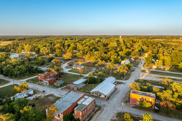 Aerial view of downtown Fair Play Missouri with water tower in background and main street in foreground