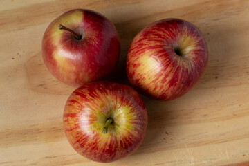 red apples on wooden table