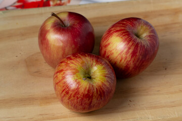 red apples on wooden table