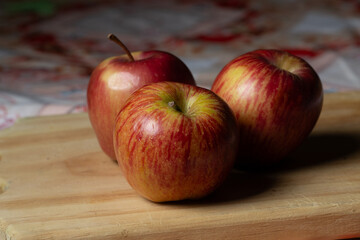 red apples on wooden table