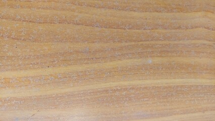 A close-up shot of wood grain texture, featuring a natural, warm brown hue and a smooth, even surface. Ideal for backgrounds, website designs, and more.