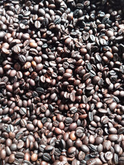 Dark coffee beans after roasting