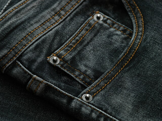 detail of the pocket of a black jeans