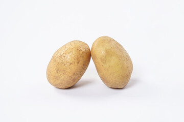 Obraz premium Washed potatoes, organic potato isolated on white background. Young potatoes. Peel potatoes.Harvesting collection. organic, freshly dug potatoes. Vegan. Vegetables.Potato slices.