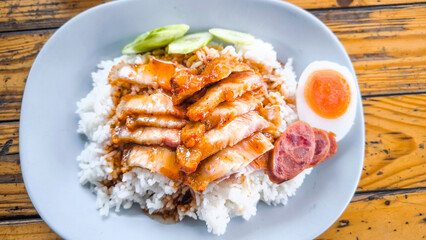 Red pork and crispy pork on rice, food in Thailand.