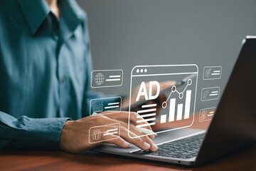 Advertising concept, PR Public relations, Businessman using laptop with advertising icon on website, plan advertising marketing strategies to target social media native, ad, advertisers, sales.